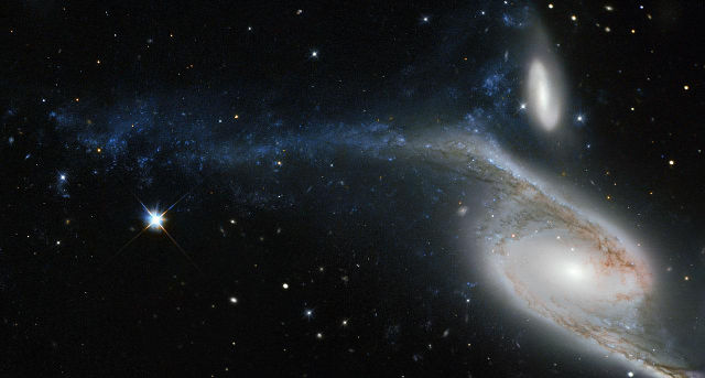 Hubble captured the spiral galaxy NGC 6872 and the smaller IC 4970