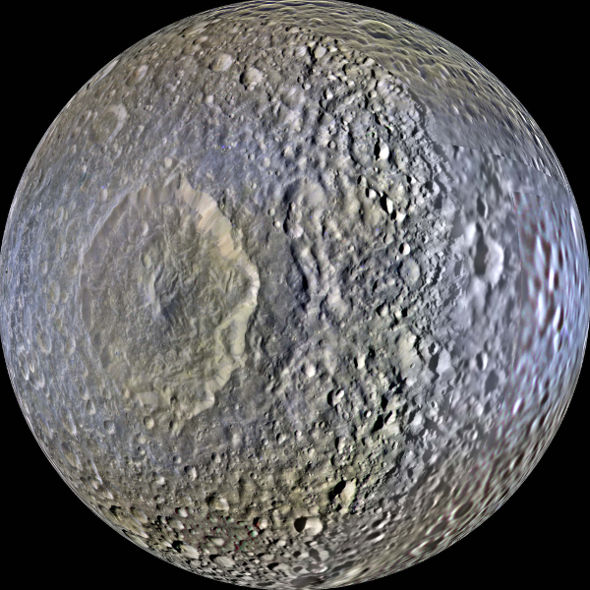 Massive impact crater on Saturn's moon Mimas