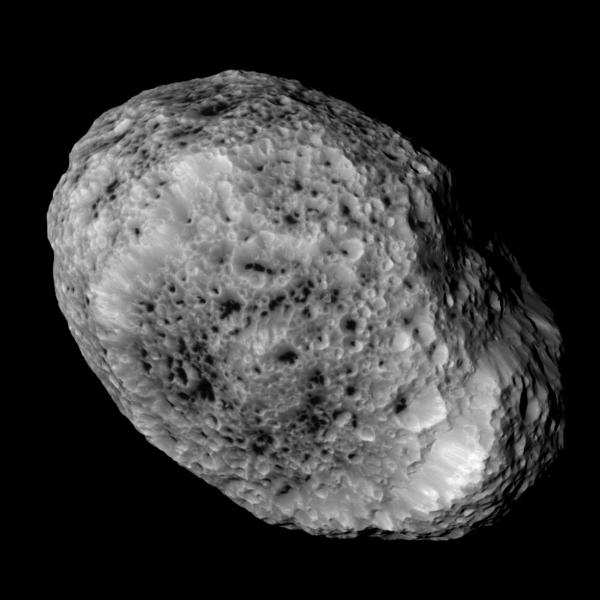 Cassini takes this picture of Hyperion as it leaves it behind